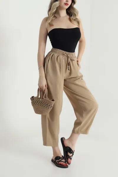 bej-tencel-boncuklu-salvar-kadin-pantolon-481048